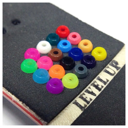 Level Up Fingerboard Bushings; Displayed on top of a fingerboard for easy visual reference; Designed to enhance performance and responsiveness; Provides customizable feel and improved maneuverability; 