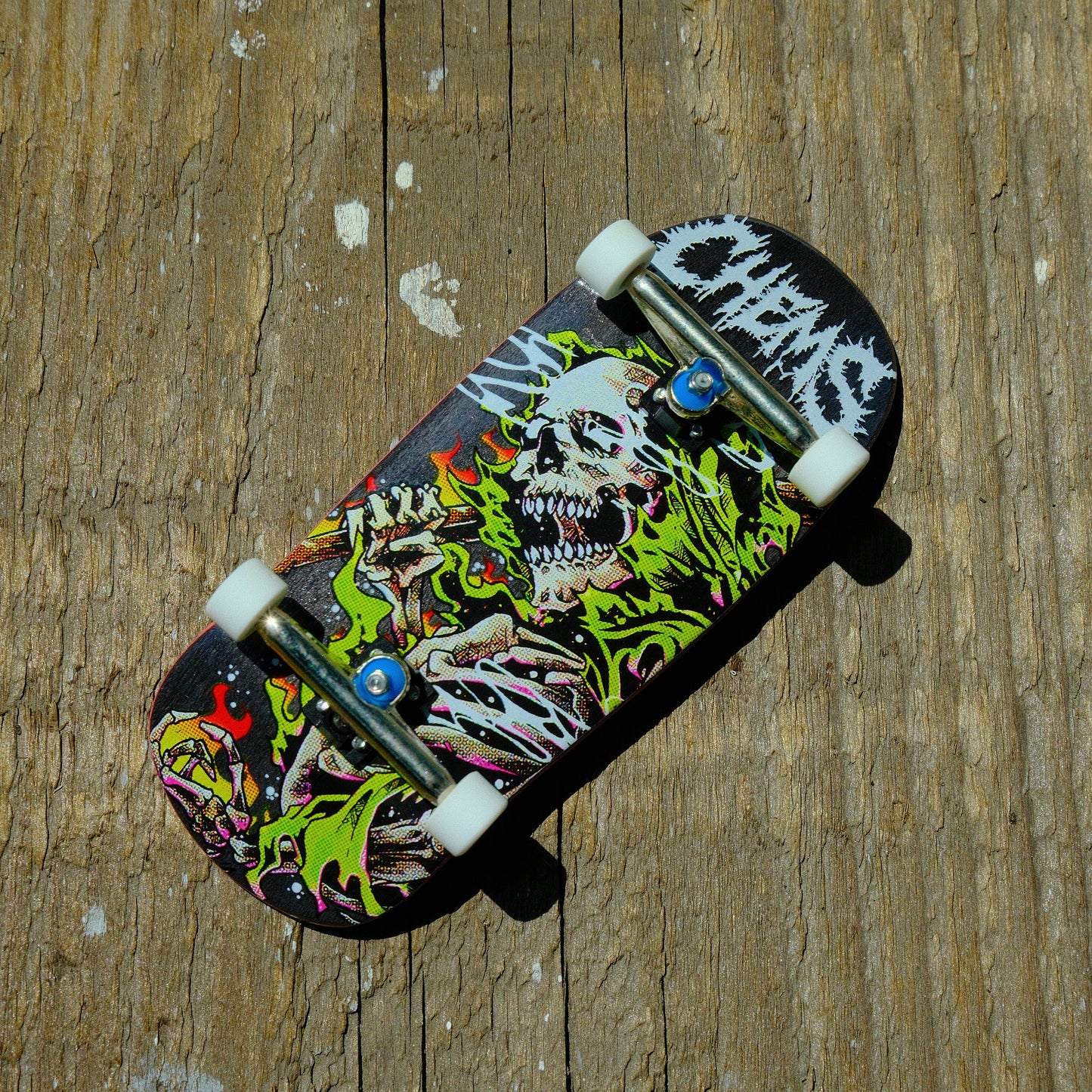 Chems 38mm Tech Cruiser Black Background Green Fire Grim Fingerboard Complete (DELI)