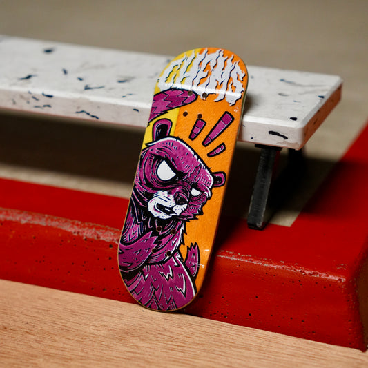 Chems “Raging Raccoon” (Yellow/Orange Split Bottom Ply) Fingerboard Deck