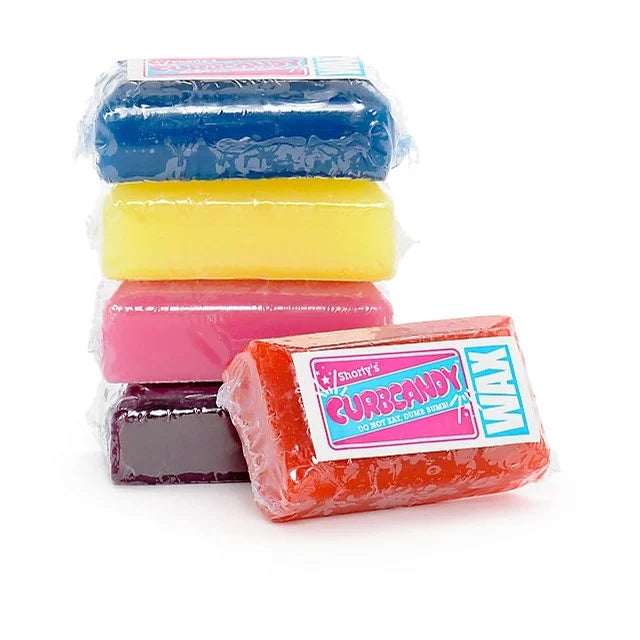 Shorty's Curb Candy Skateboard Wax; Available in a variety of colors; Features "CurbCandy" in bubble letters on the label; Provides smooth and consistent slides on curbs and rails; Ideal for enhancing grindability;