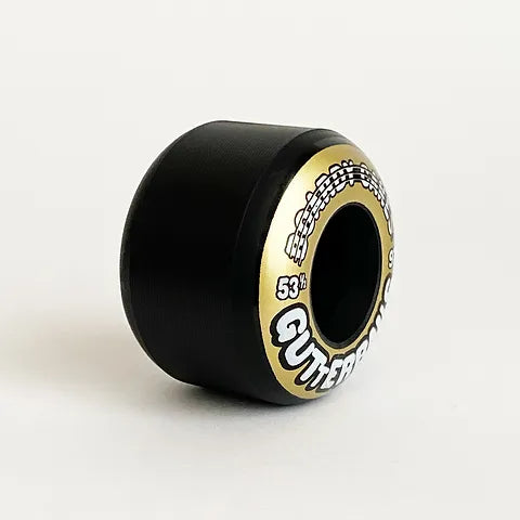 Angle to show width; Boardy Cakes Gutterballs Skateboard Wheels; Black wheels with a goldish yellow side print; Features the word "Gutterballs" in bold letters;