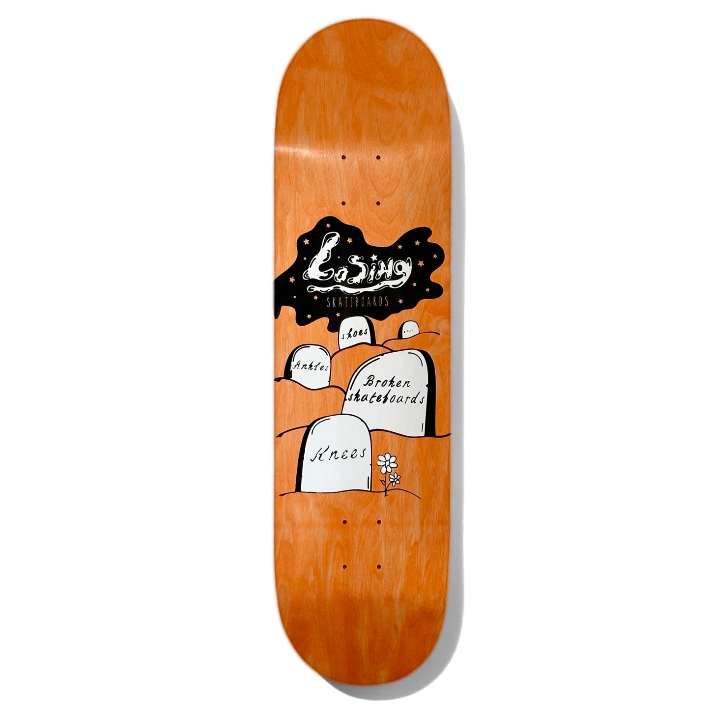 Losing Graveyard Skateboard Deck; Orange background; Illustrated black and white graphic features graveyard with headstones that read “Knees,” “Broken Skateboards,” “Ankles,” and “Shoes”; White Lettering spells out “Losing Skateboards” across night sky in back of graveyard